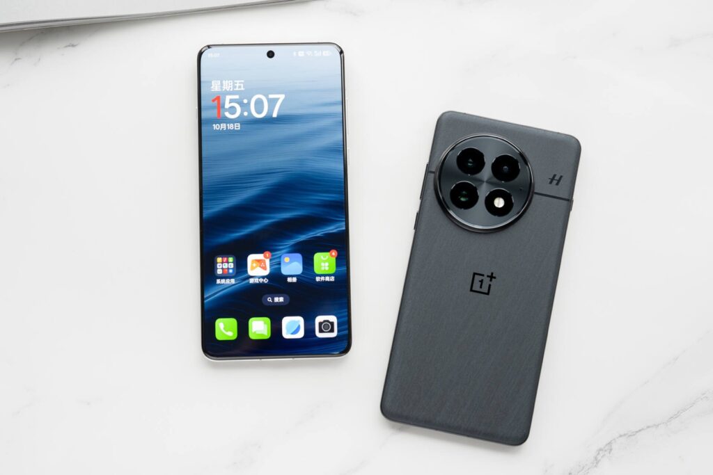 OnePlus 13 smartphone displayed front and back, showcasing its circular triple-camera setup, curved-edge display, and premium black finish.